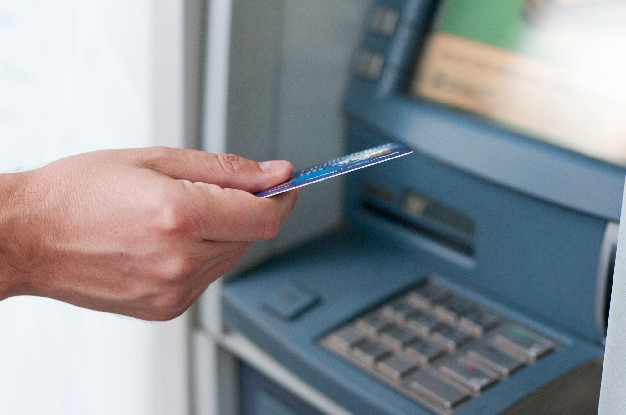hand-inserting-atm-card-into-bank-machine-withdraw-money-businessman-men-hand-puts-credit-card-into-atm hand-inserting-atm-card-into-bank-machine-withdraw-money-businessman-men-hand-puts-credit-card-into-atm