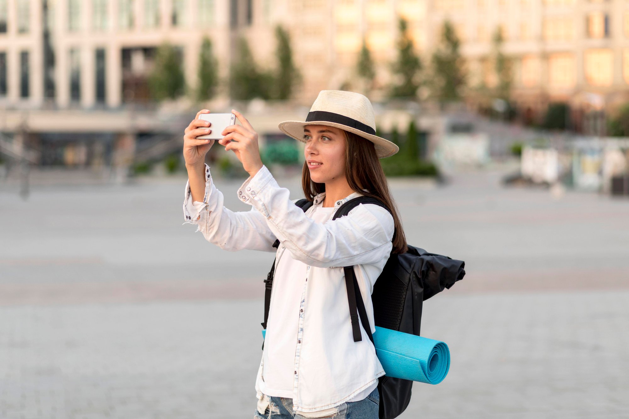 side-view-woman-taking-pictures-with-smartphone-while-traveling side-view-woman-taking-pictures-with-smartphone-while-traveling